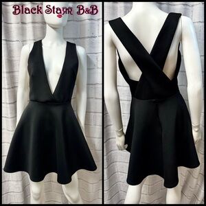 Black flared sleeveless plunging V neckline mini dress. Sz Md